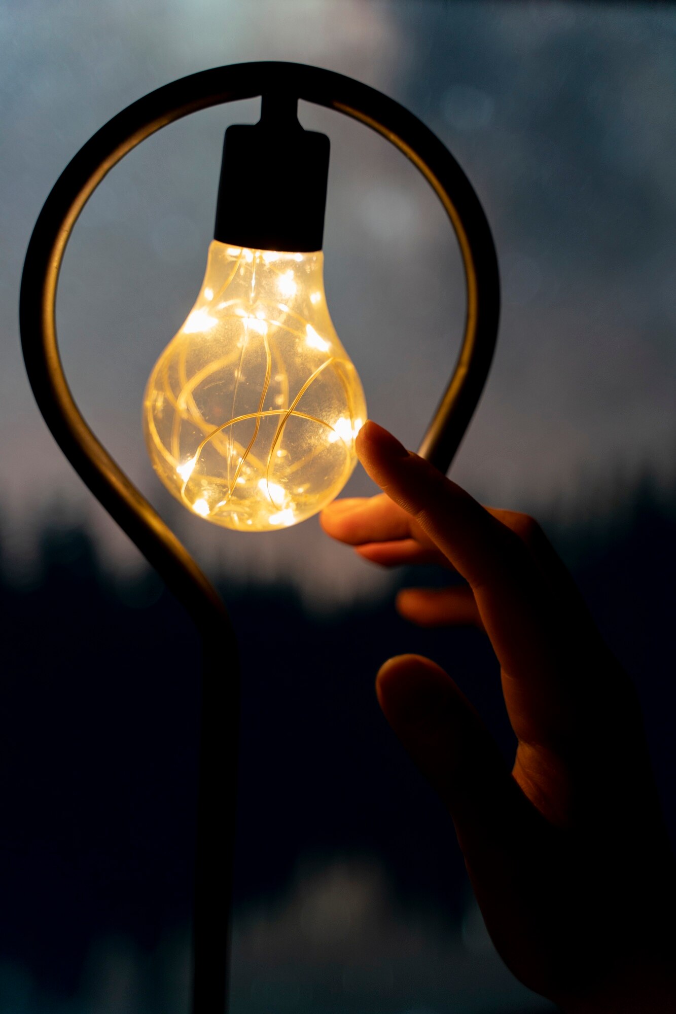 view hands holding lightbulb lamp 23 2150571064